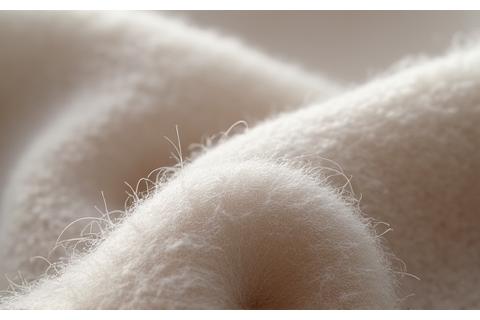 Close-up texture of soft, luxurious recycled cashmere fabric